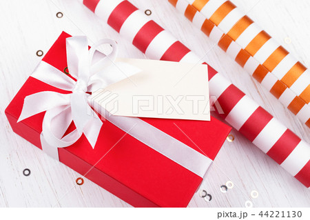 Christmas gift box wrapped in red gift paper. Christmas gift box wrapped in red gift paper. 44221130