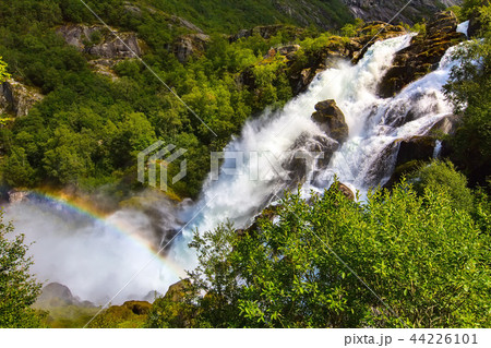 Rainbow and Briksdal waterfall in Norway 44226101