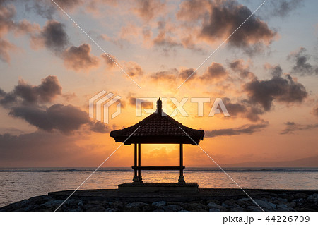 Sunshine in pavilion on jetty at coastline 44226709