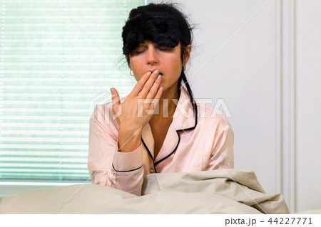 Woman waking up in morning Woman waking up in morning 44227771