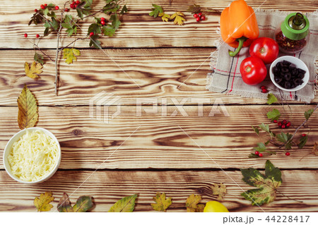 Composition with autumn leaves,cooking ingridients 44228417