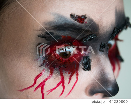 Portrait of a female vampire over black background 44229800