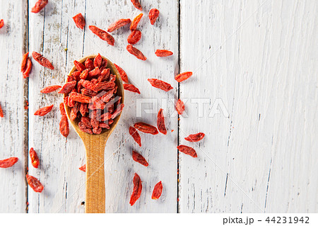 Dry goji berry on old white wooden background. Dry goji berry on old white wooden background. 44231942