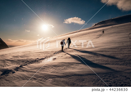 Climbers with backpack climbing on snowy mountain Climbers with backpack climbing on snowy mountain 44236630