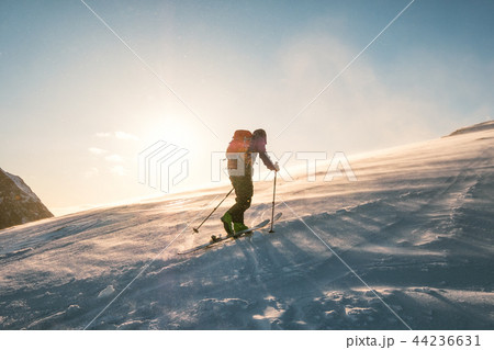 Man skier with backpack trekking on snow mountain Man skier with backpack trekking on snow mountain 44236631