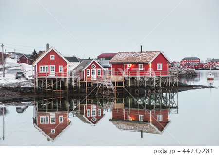 Scandinavian village with red house reflection Scandinavian village with red house reflection 44237281