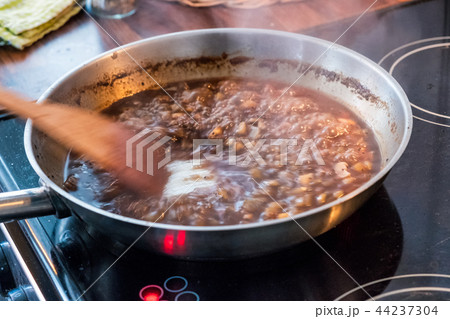 Wooden flipper chewing sweet sauce with garlic Wooden flipper chewing sweet sauce with garlic 44237304