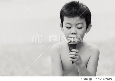 asian boy children eating ice cream candid asian boy children eating ice cream candid 44237989