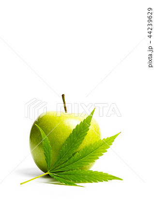 Green apple and marijuana leaf isolated Green apple and marijuana leaf isolated 44239629