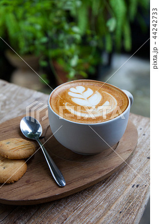 cup of coffee and cookie in coffee shop vintage co 44242733