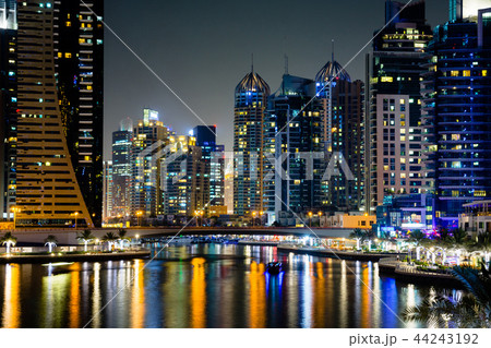 Dubai marina skyscrapers reflected in the water at night 44243192