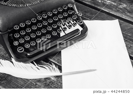 Antique vintage typewriter in on a wooden table Antique vintage typewriter in on a wooden table 44244850