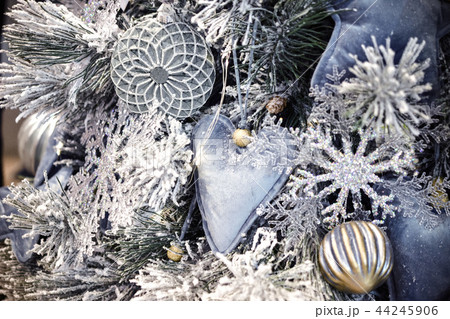 Decorative snow-covered Christmas tree decorated with decorative 44245906