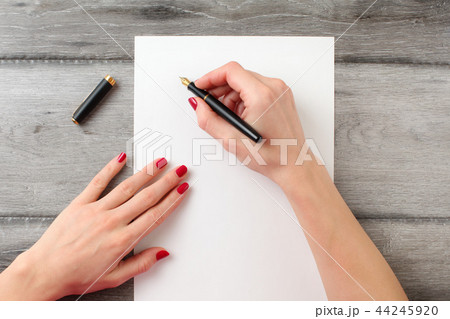 View from above to woman writing letter View from above to woman writing letter 44245920
