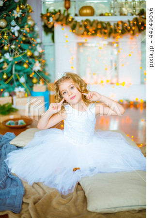 Cute little girl near a Christmas tree Cute little girl near a Christmas tree 44249056