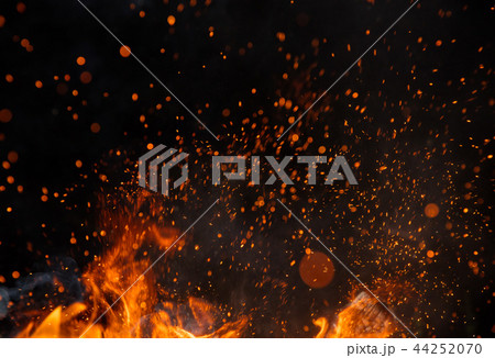 Fire sparks with flames on black background Fire sparks with flames on black background 44252070
