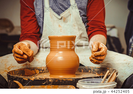 Potter makes a jug 44252405