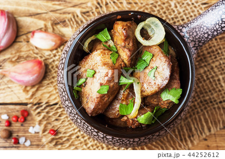 Baked chicken liver with onion in a ceramic Baked chicken liver with onion in a ceramic 44252612