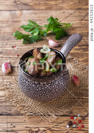 Baked chicken liver with onion in a ceramic Baked chicken liver with onion in a ceramic 44252613