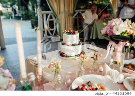 Beautiful cake covered with icing cream, summer berries on the top. 44253094