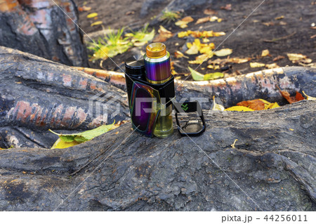 electronic cigarette is standing on the root  44256011