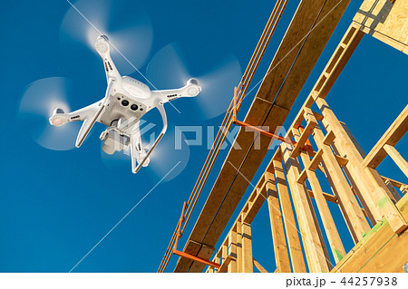 Drone Flying Over and Inspecting Construction Site Drone Flying Over and Inspecting Construction Site 44257938