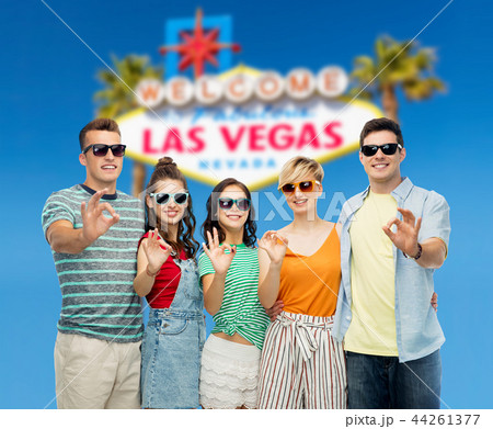 friends in sunglasses showing ok hand sign friends in sunglasses showing ok hand sign 44261377