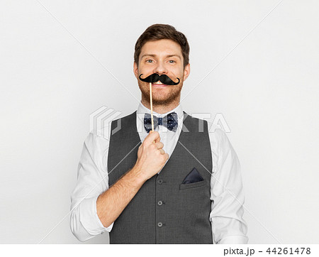 happy young man with fake moustache happy young man with fake moustache 44261478