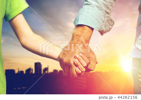 close up of grandfather and grandson holding hands 44262156