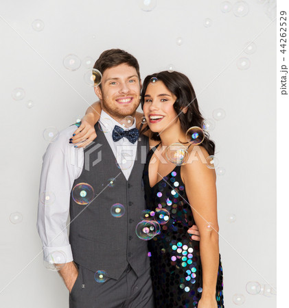 happy couple hugging in soap bubbles at party happy couple hugging in soap bubbles at party 44262529