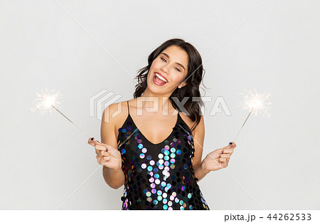 happy young woman with sparklers at party 44262533