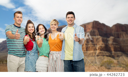 friends showing thumbs up over grand canyon friends showing thumbs up over grand canyon 44262723