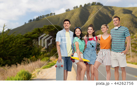 friends with skateboards over big sur hills 44262756