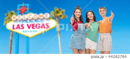 happy teenage girls showing thumbs up at las vegas 44262764