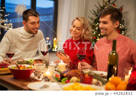 friends with cellphone celebrate christmas at home friends with cellphone celebrate christmas at home 44262832