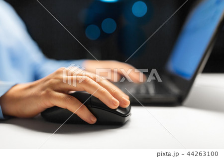 close up of female hand using computer mouse close up of female hand using computer mouse 44263100
