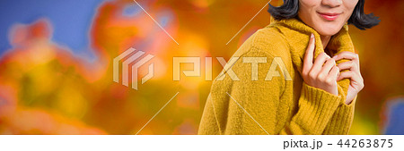 Composite image of woman in winter clothing posing against white background Composite image of woman in winter clothing posing against white background 44263875