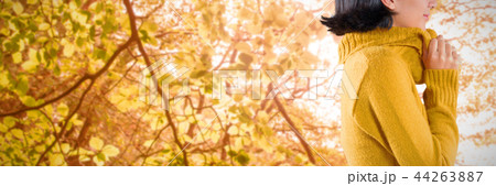 Composite image of woman in winter clothing posing against white background Composite image of woman in winter clothing posing against white background 44263887