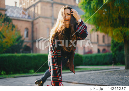 stylish girl walking through the city 44265287