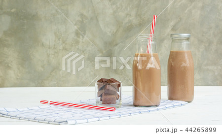 Chocolate milk on a white wooden table. 44265899