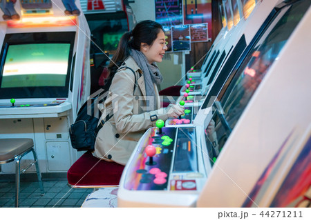 cheerful woman happily playing game 44271211