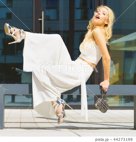 Woman wearing crop top and culottes Woman wearing crop top and culottes 44273199