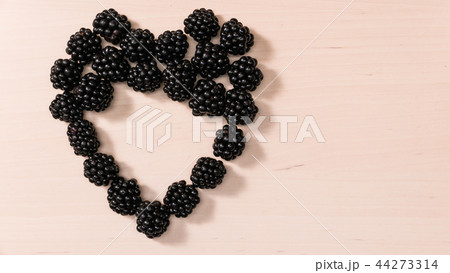 Fresh berries of blackberry in form heart Fresh berries of blackberry in form heart 44273314