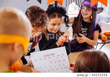 Children with painted faces cannot wait till the beginning of Halloween party 44273338