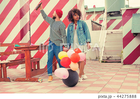 Sleepy young couple searching for alcohol after having big party 44275888