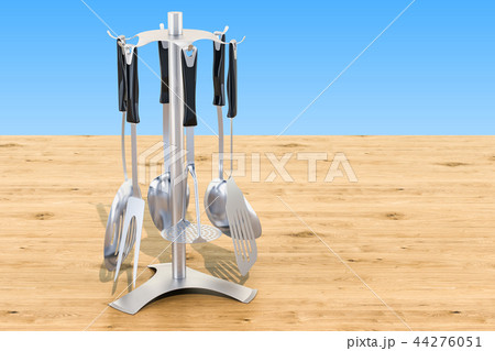 Kitchen utensils with stand on the wooden table Kitchen utensils with stand on the wooden table 44276051