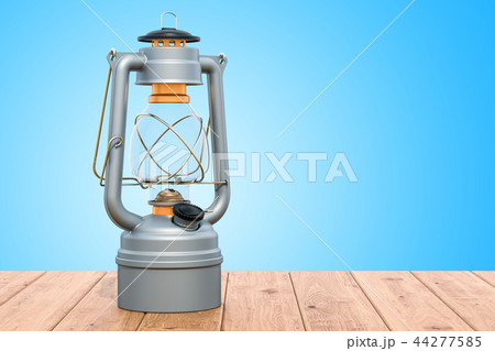 Antique Kerosene Lantern on the wooden table Antique Kerosene Lantern on the wooden table 44277585