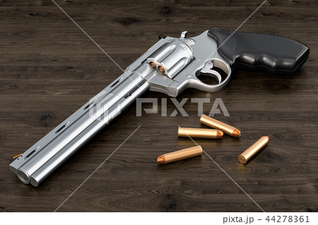 Revolver with bullets on the wooden table Revolver with bullets on the wooden table 44278361