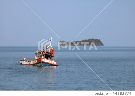 Wreckage wooden fishing boat broken near the beach 44282774