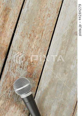 Microphone on wooden background and text space. 44284279